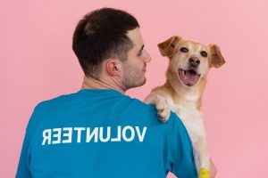 a man holding a dog